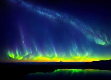 An aurora bore over a lake at night An aurora bore over a lake at night